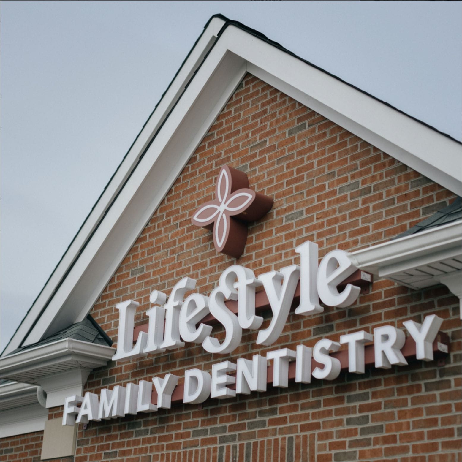 Exterior view of Lifestyle Family Dentistry building with large signage